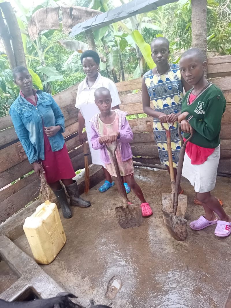 Family carrying shovels for farming